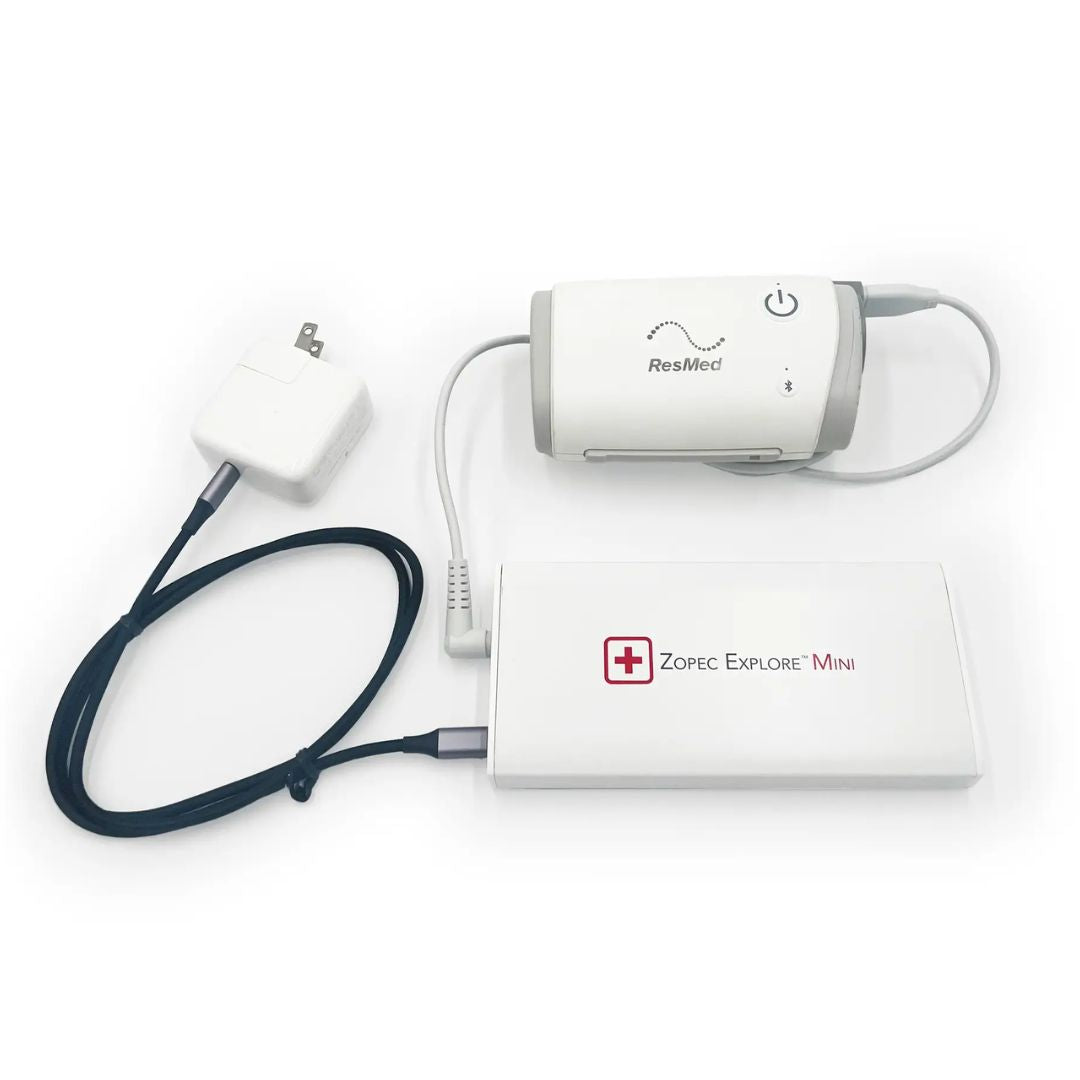 Zopec Explore Mini CPAP battery - world's smallest 1-pound medical-grade power source for ResMed/Philips machines, shown next to AirMini for size comparison