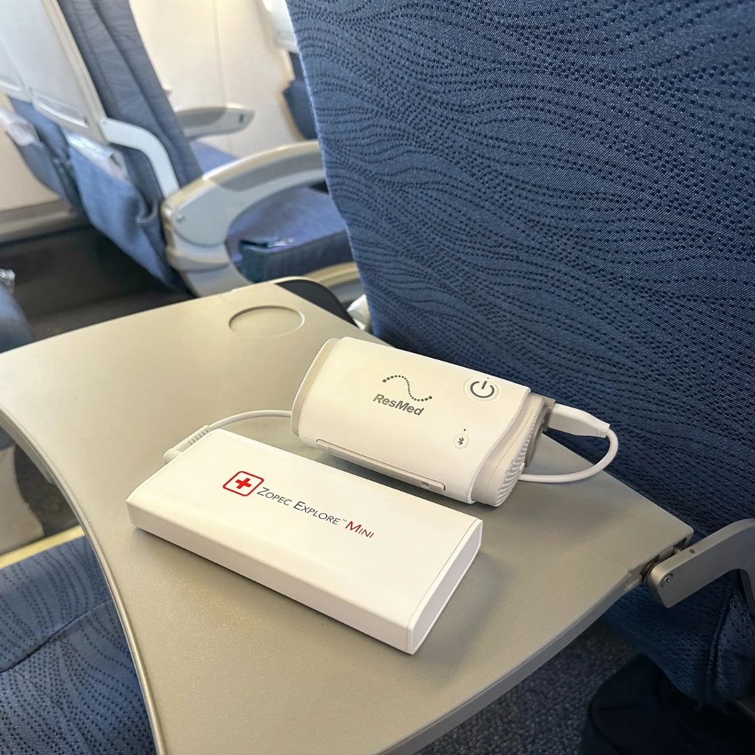 Zopec Explore Mini CPAP battery - world's smallest 1-pound medical-grade power source for ResMed/Philips machines, shown next to AirMini for size comparison